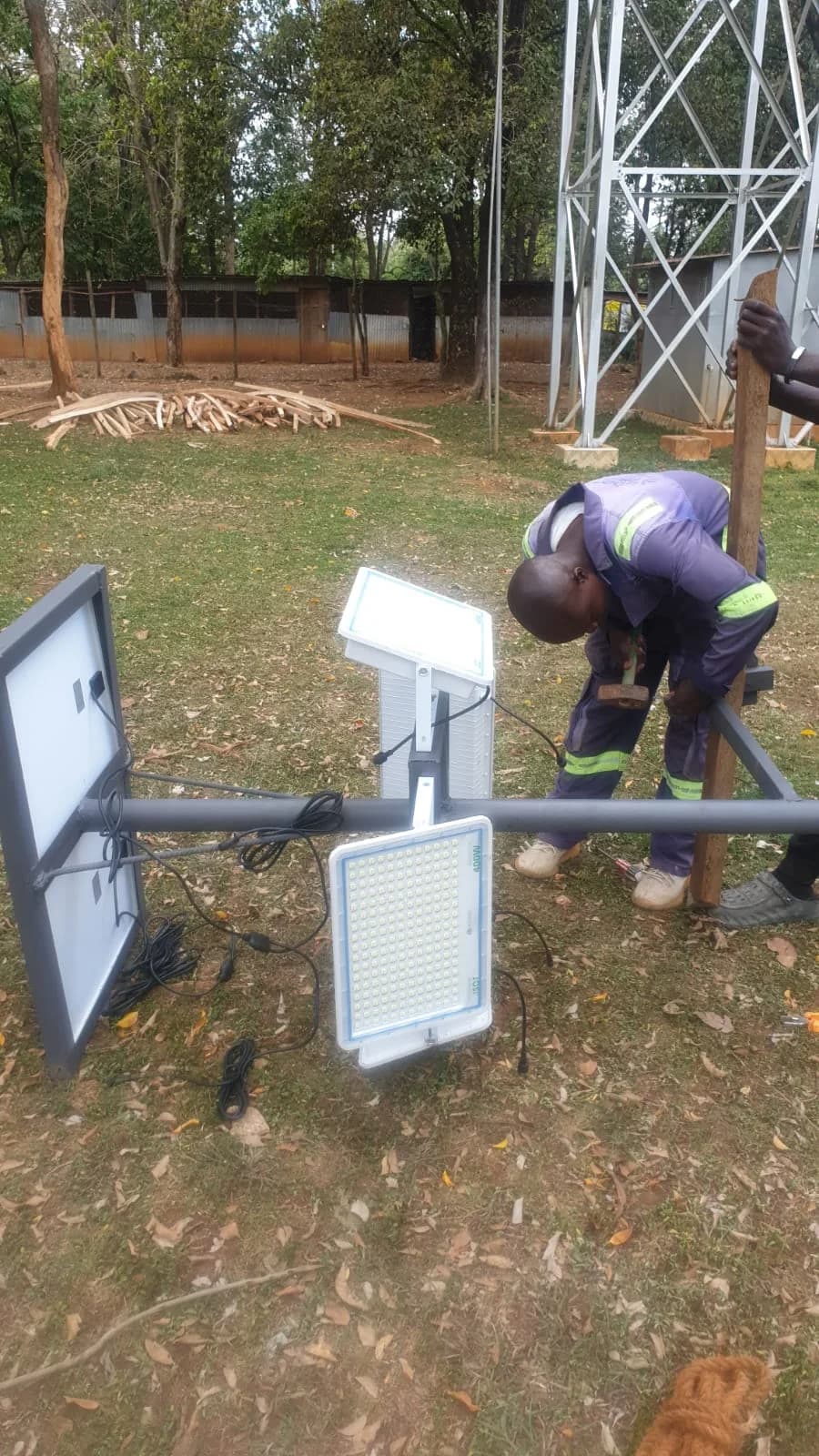 RURERA Solar field technician installing a solar floodlight