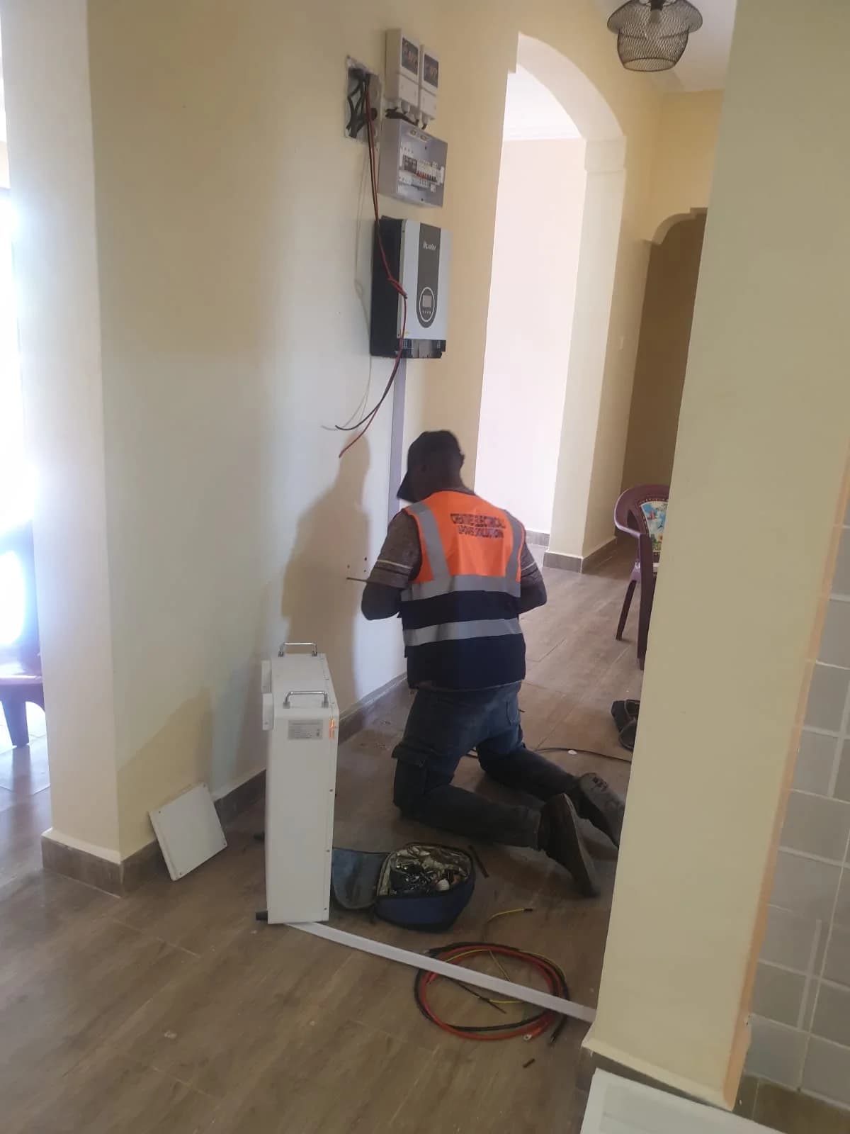 RURERA Solar electrician installing a distribution panel